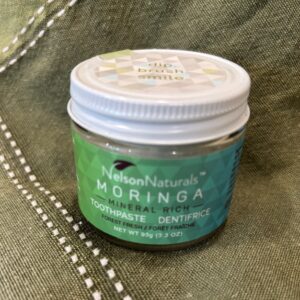 93 gram tin-lidded glass jar of moringa toothpaste