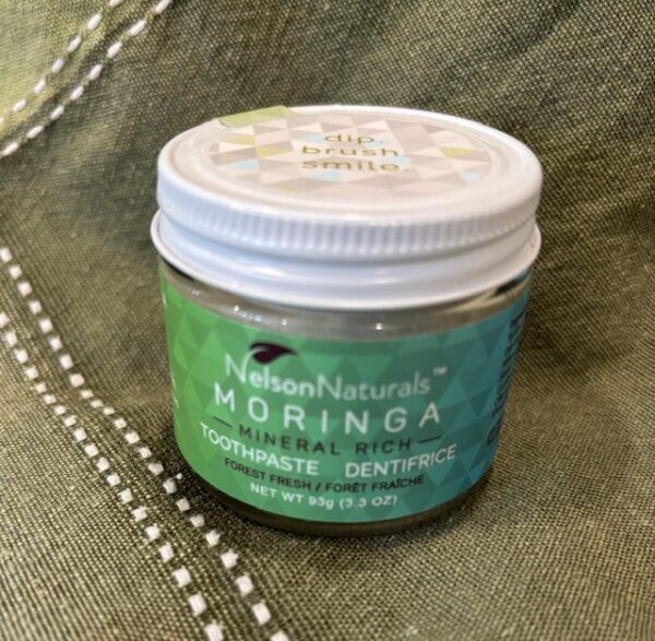 93 gram tin-lidded glass jar of moringa toothpaste